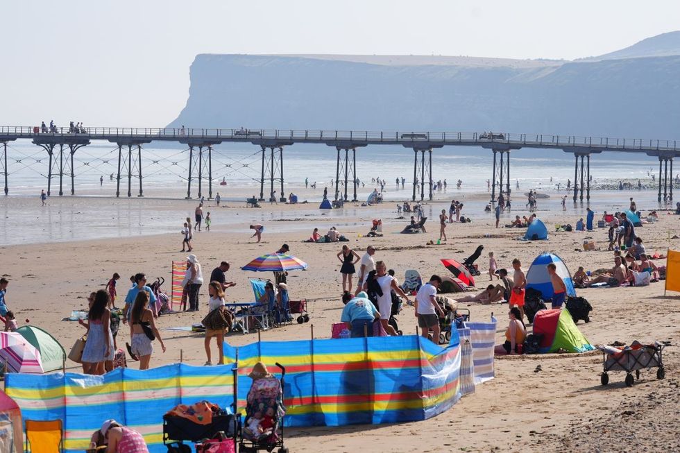 People on the beach at Saltburn-by-the-Sea in North Yorkshire