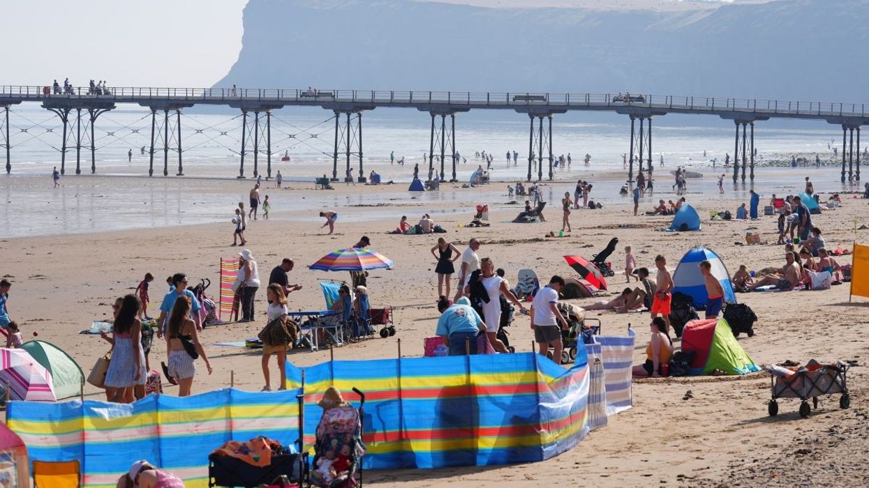 People on the beach at Saltburn-by-the-Sea in North Yorkshire