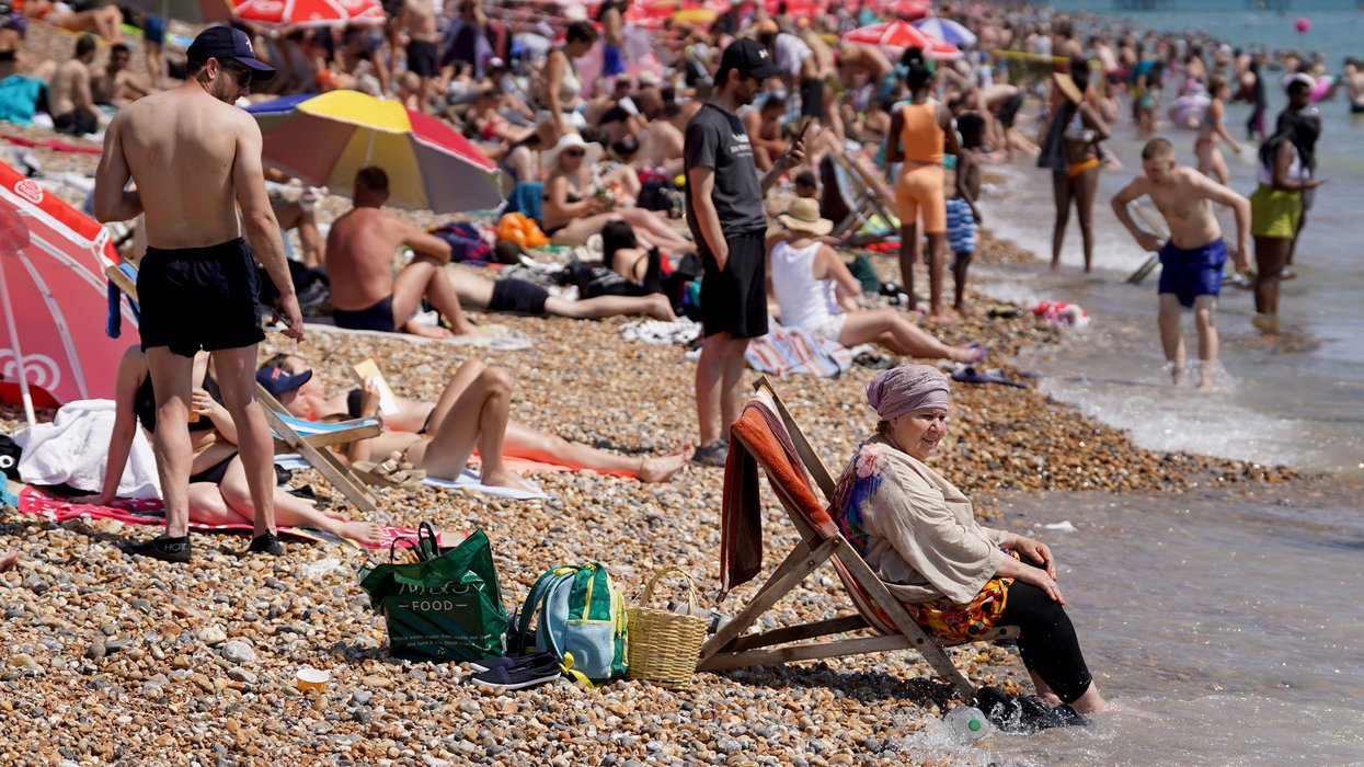 People on the beach in Brighton, East Sussex.
