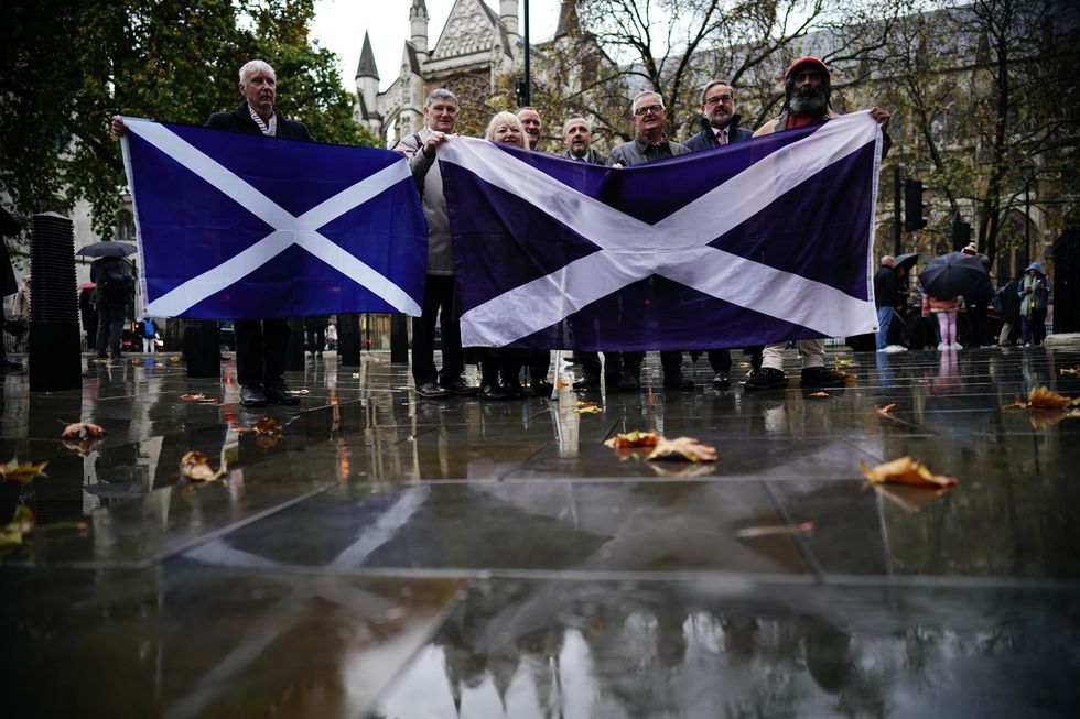 People outside the UK Supreme Court in London, waiting for the decision by Supreme Court judges to grant or refuse the Scottish Parliament power to hold a referendum on independence. Picture date: Wednesday November 23, 2022.