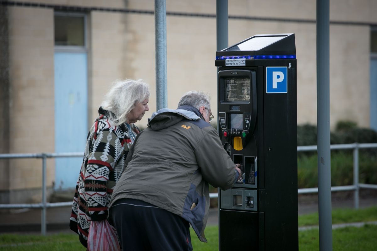 People paying for parking