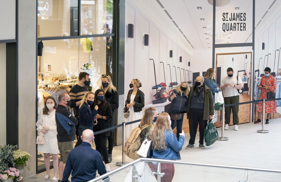 People queue for shops at the opening of the St James Quarter shopping centre in Edinburgh. The first phase of the new shopping centre has opened after five years of construction. Issue date: Thursday June 24, 2021.