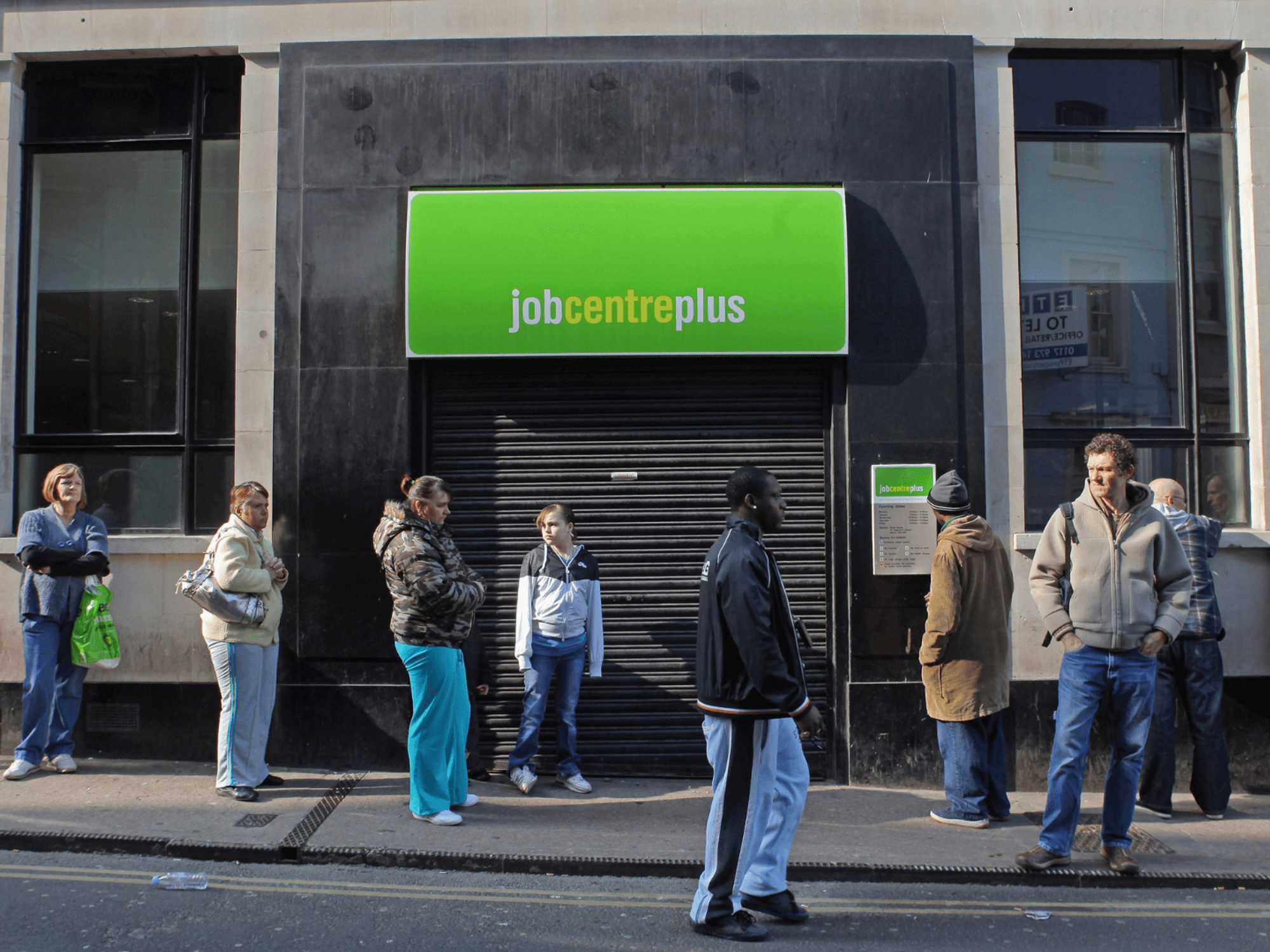 People queue outside a Job Centre