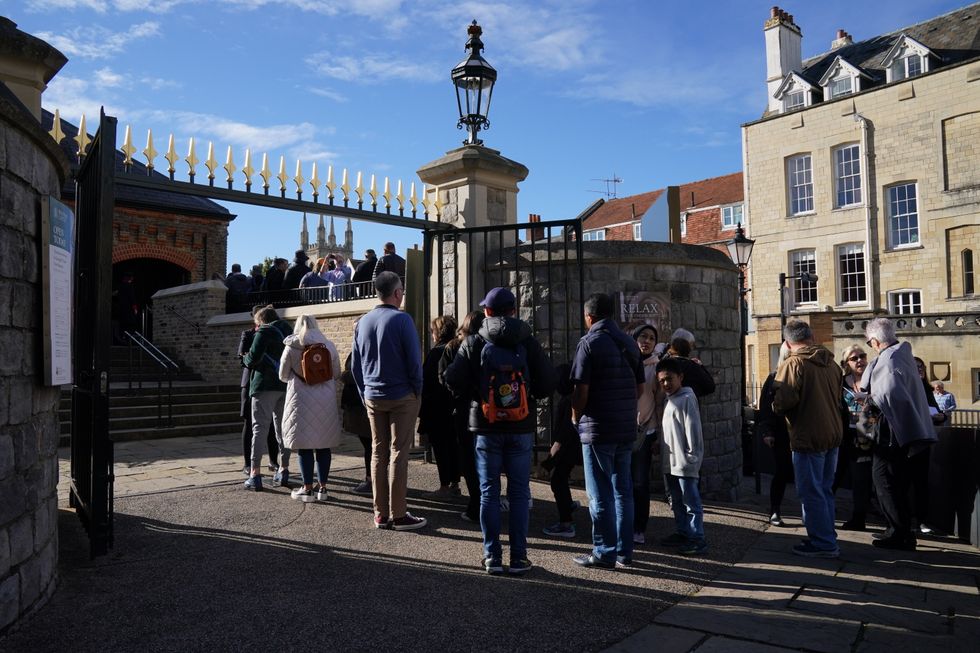 People queue outside as Windsor Castle and St George's Chapel reopen to public for first time since Queen Elizabeth II's death. The first members of the public will be able to visit the Queen's final resting place and view the ledger stone in the George VI Memorial Chapel which is inscribed with her name. Picture date: Thursday September 29, 2022.