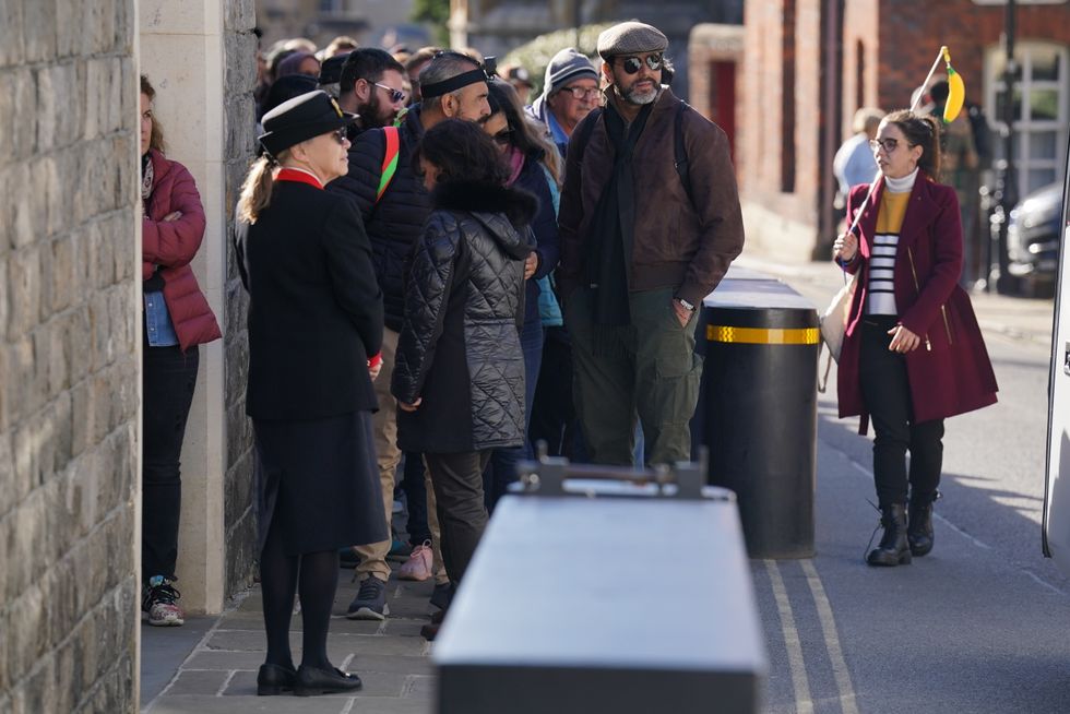 People queue outside as Windsor Castle and St George's Chapel reopen to public for first time since Queen Elizabeth II's death. The first members of the public will be able to visit the Queen's final resting place and view the ledger stone in the George VI Memorial Chapel which is inscribed with her name. Picture date: Thursday September 29, 2022.