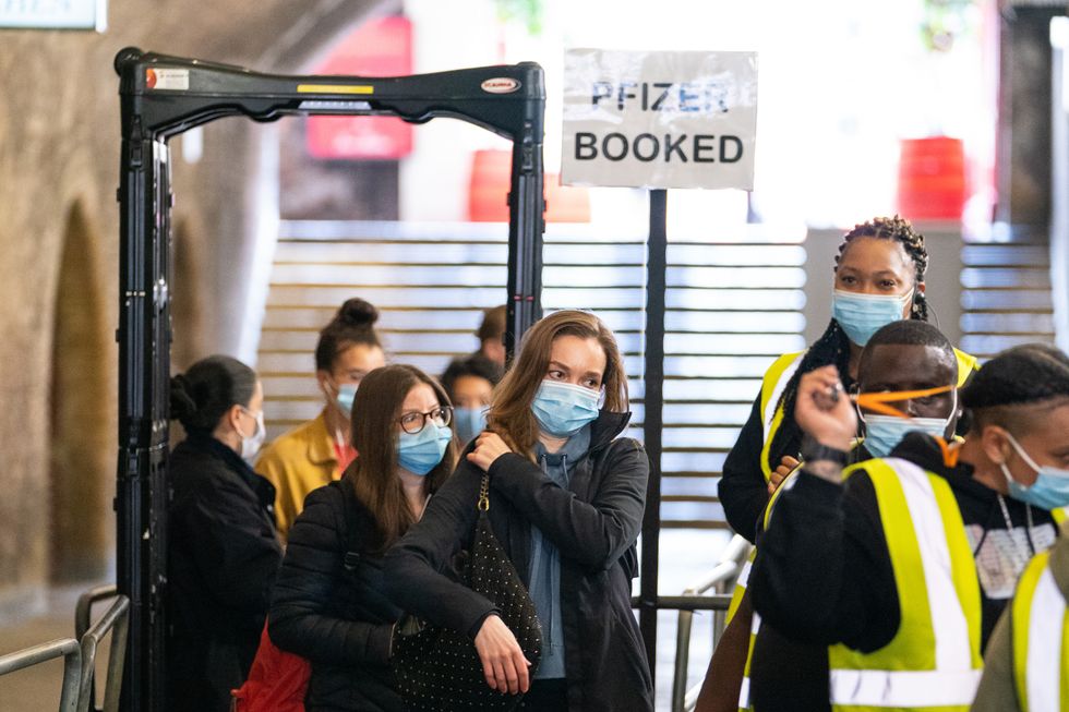 People queue to enter a covid vaccination event at Heaven nightclub in central London. Picture date: Sunday August 8, 2021.
