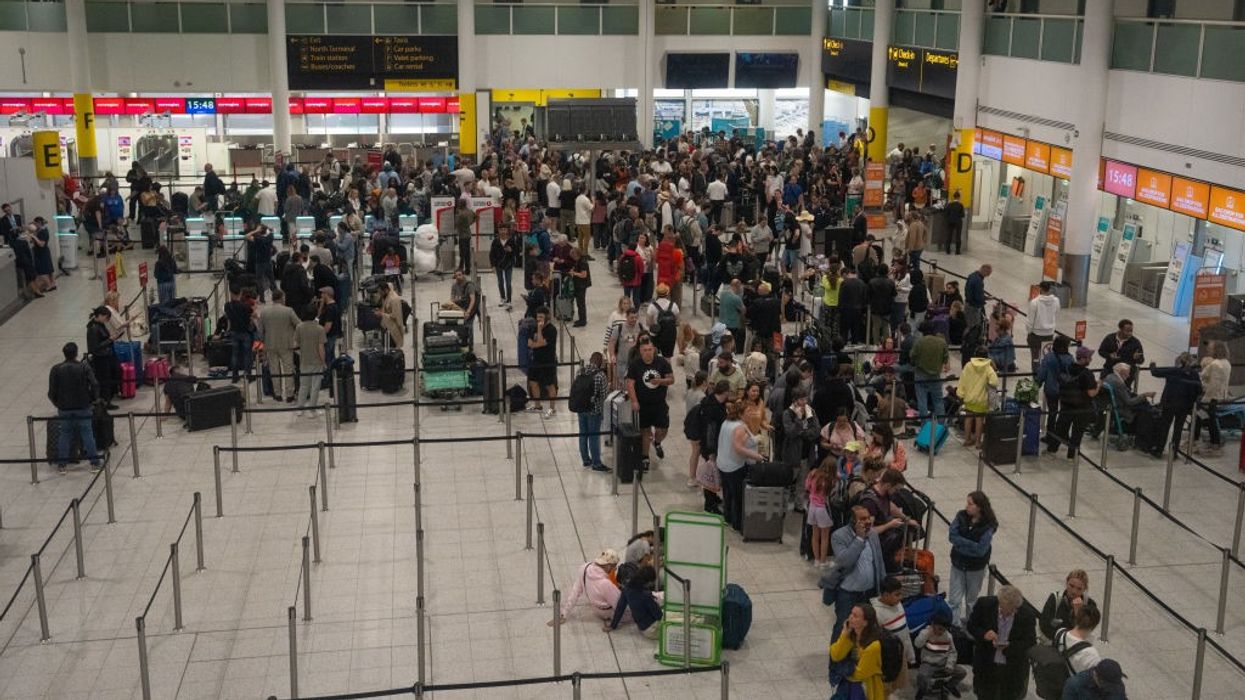 People queueing at Gatwick Airport