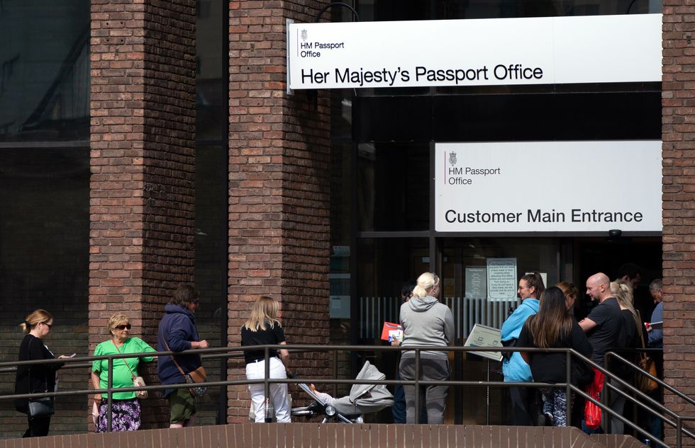 People queuing outside the passport office in Peterborough, as thousands of Brits face the prospect of lengthy delays for passport applications due to a combination of staff shortages and a surge in post-Covid travel. Picture date: Monday May 16, 2022.