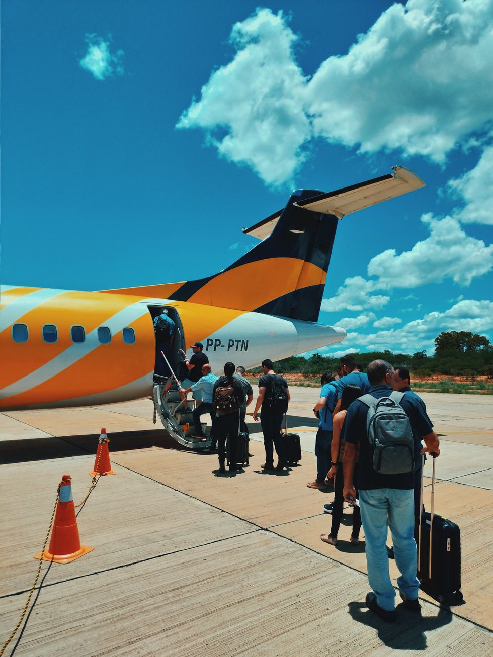 People queuing to get on flight