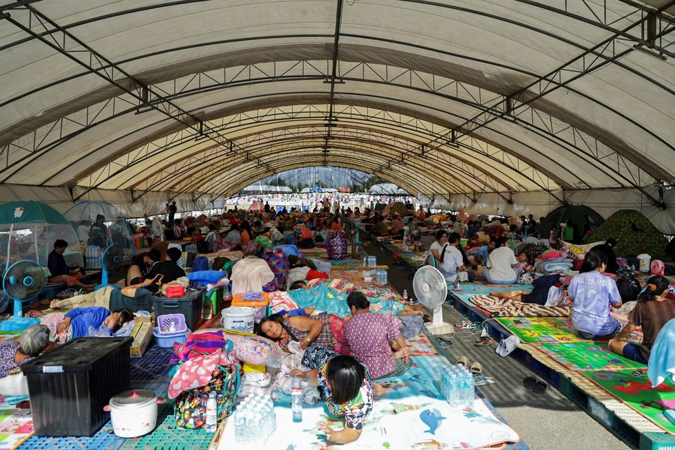 People rest at a shelter after Thailand-Cambodia border violence