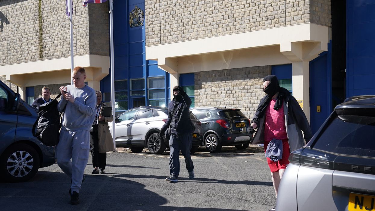 People seen outside HM Prison Durham. Around 1,700 inmates are expected to be let out early in an attempt to ease overcrowding in prisons