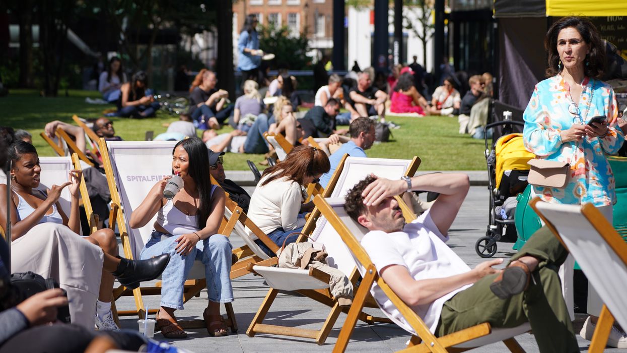 People sitting on chairs in the sun