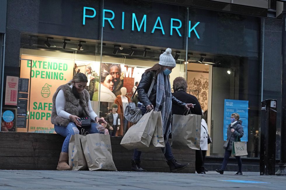 People sitting outside Primark