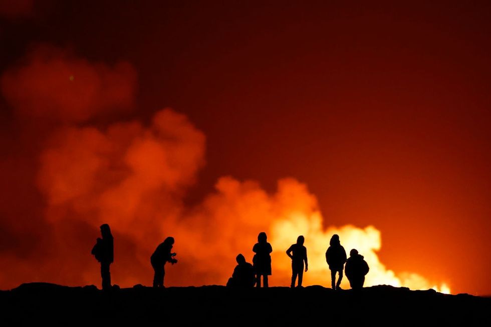 People stood by volcano