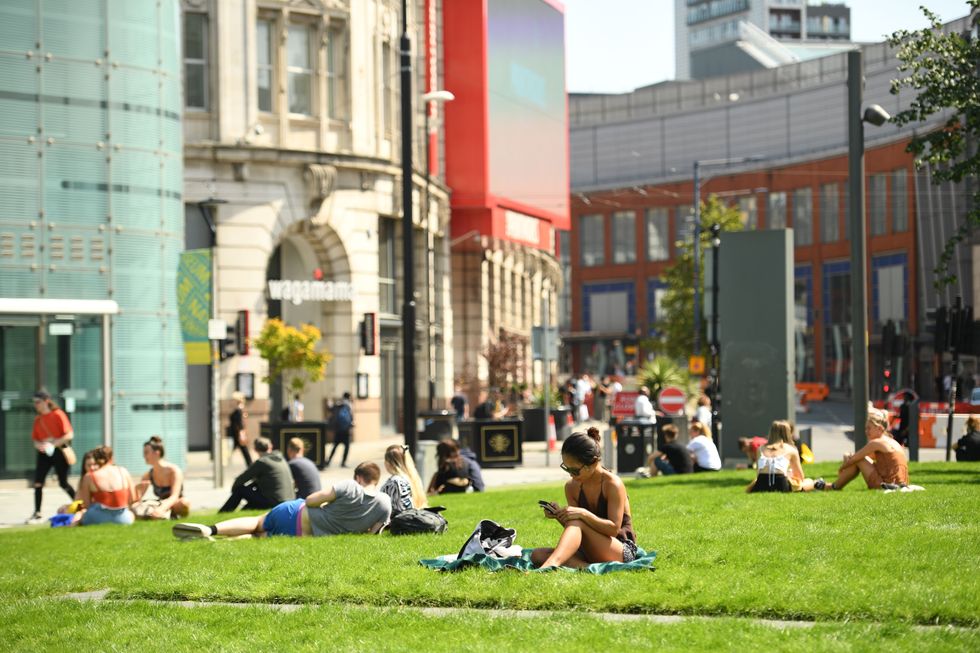 People sunbathing in Manchester