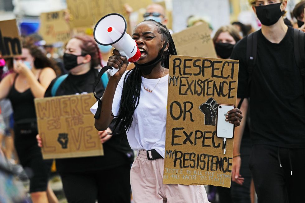 People take part in a Black Lives Matter protest in Brighton, sparked by the death of George Floyd, who was killed on May 25 2020 while in police custody in the US city of Minneapolis.