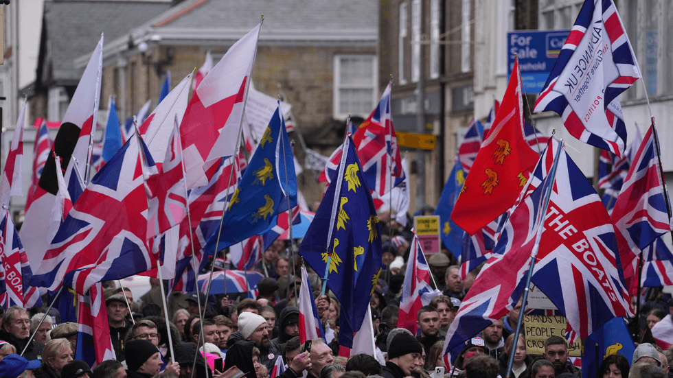 People take part in a protest in Crowborough, East Sussex, after the first 27 illegal migrants were moved into Crowborough Training Camp