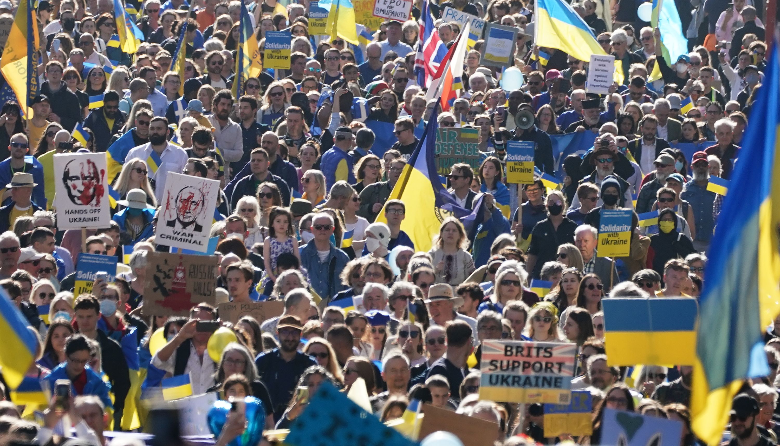 People take part in a solidarity march in London for Ukraine.
