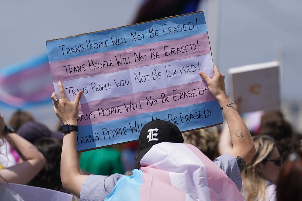 People take part in a Trans Pride protest march in Brighton