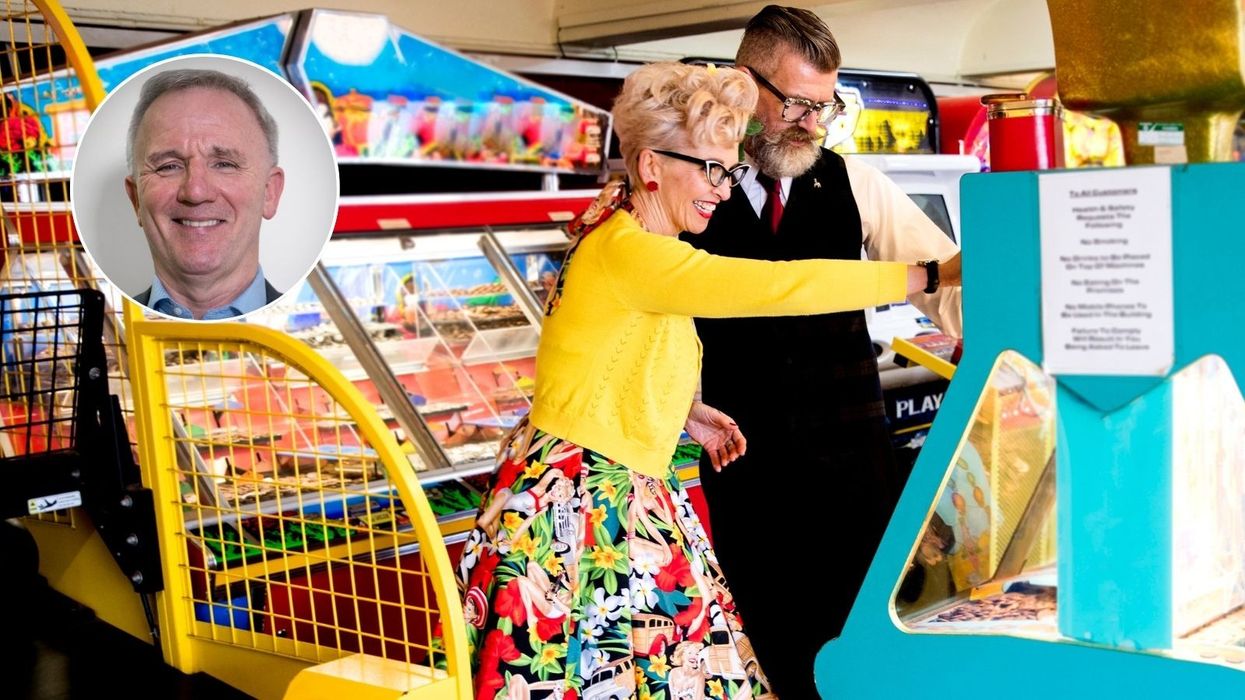 People using coin pusher machine at seaside amusement arcade and photo of Ron Delnevo