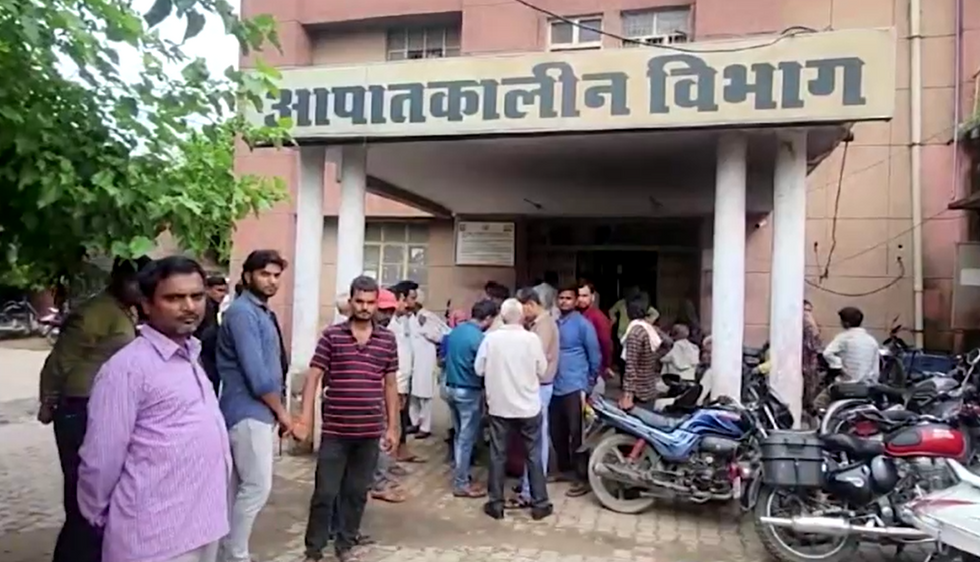 People waiting outside a hospital in Uttar Pradesh
