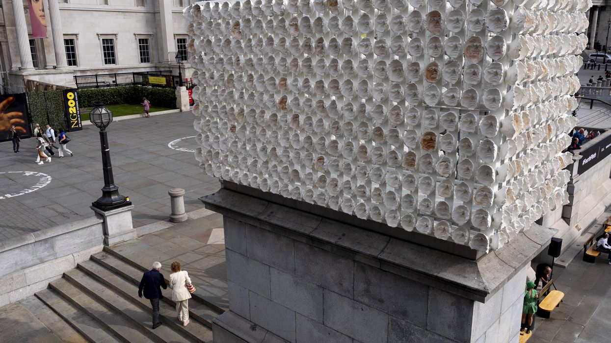 People walk past Mil Veces un Instante (A Thousand Times in an Instant) by Teresa Margolles