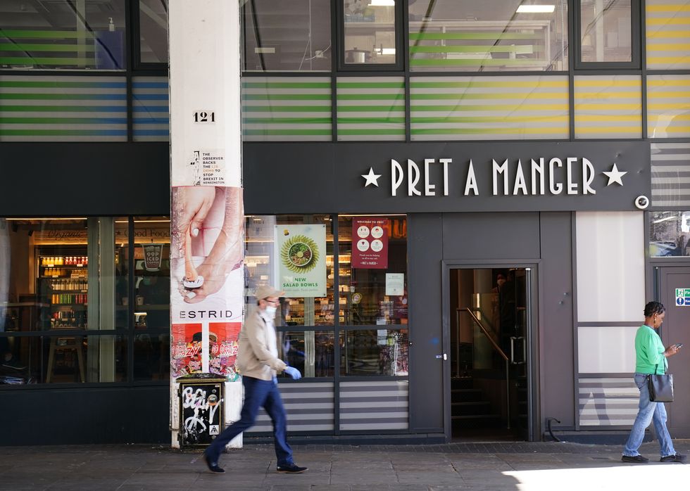 People walk past the Pret A Manger in Ladbroke Grove, Notting Hill, in west London.