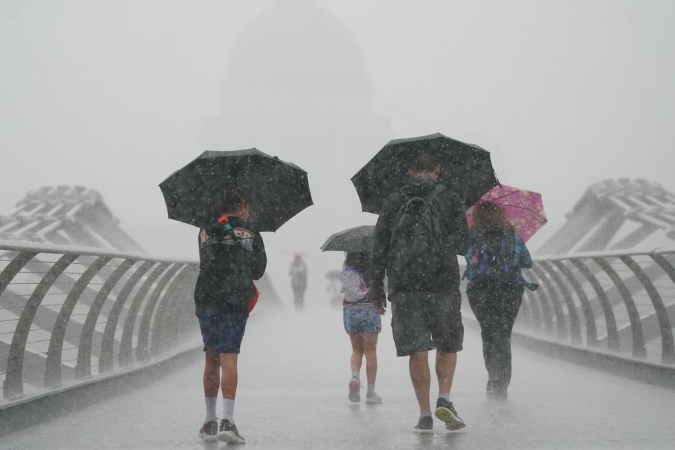 People walking in torrential rain