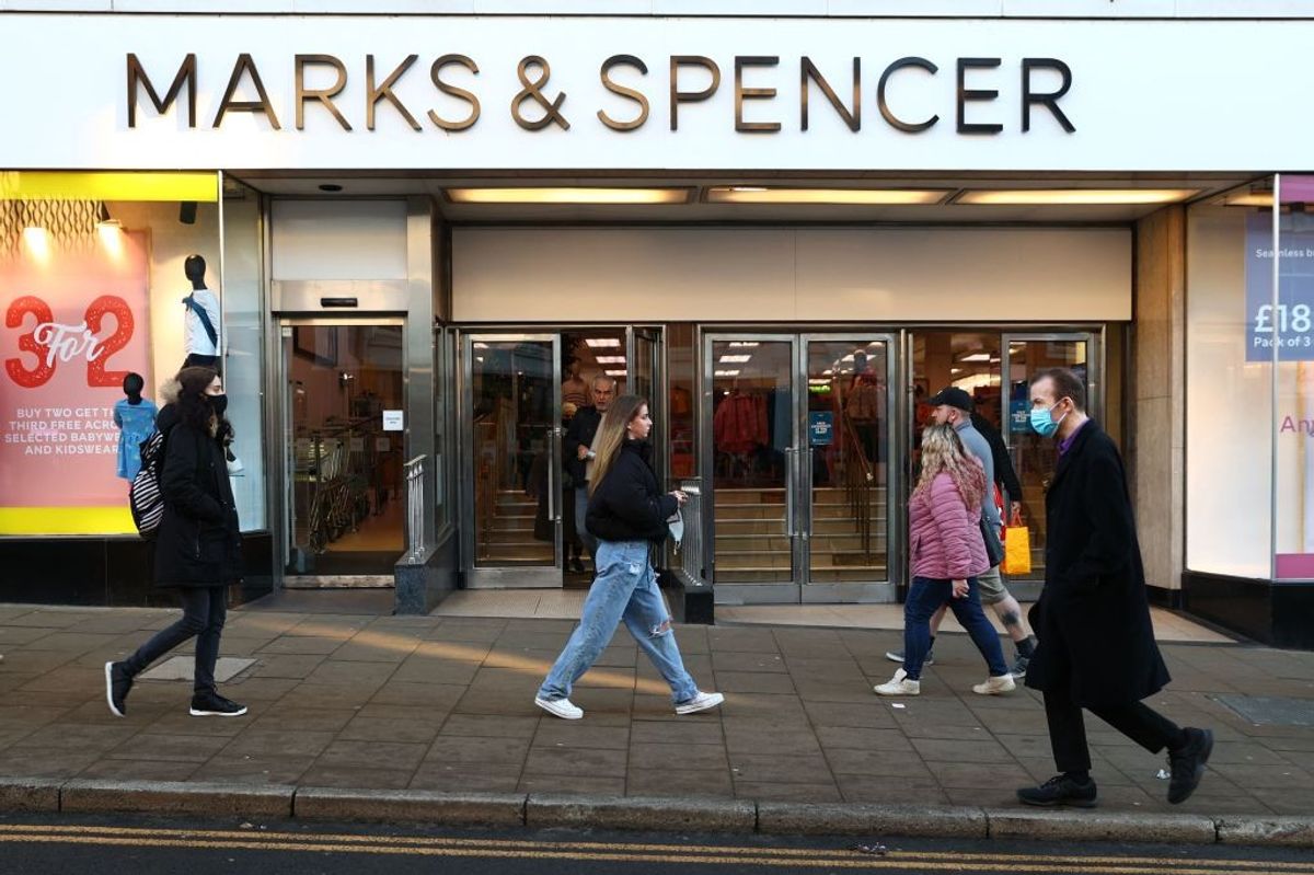 People walking past Marks & Spencer