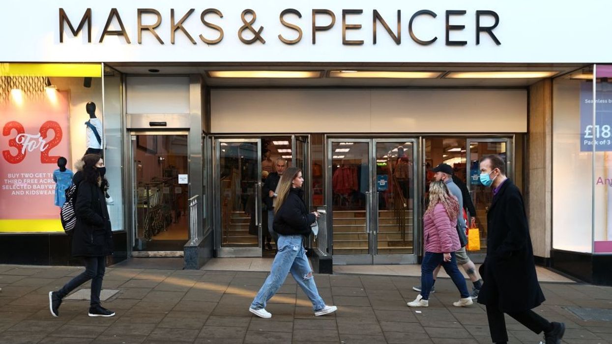 People walking past Marks & Spencer