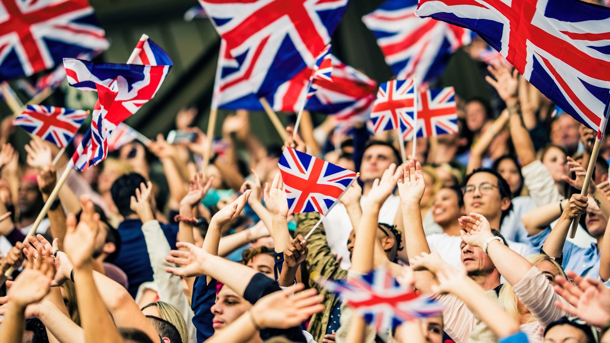 People waving Union Jack flags
