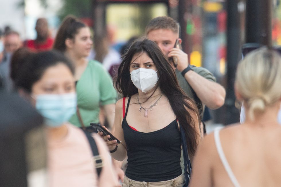 People wearing face mask in central London, after the final coronavirus legal restrictions were lifted in England.