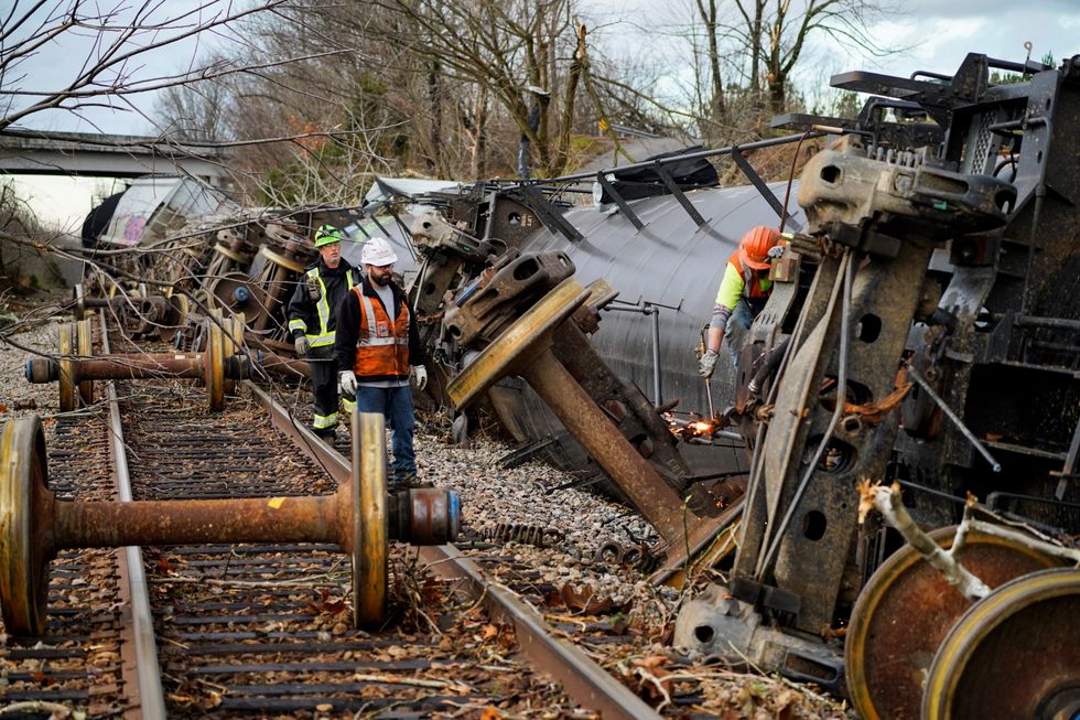 People work at the scene of a train derailment after a devastating outbreak of tornadoes ripped through several U.S. states in Earlington, Kentucky, U.S. December 11, 2021.  REUTERS/Cheney Orr