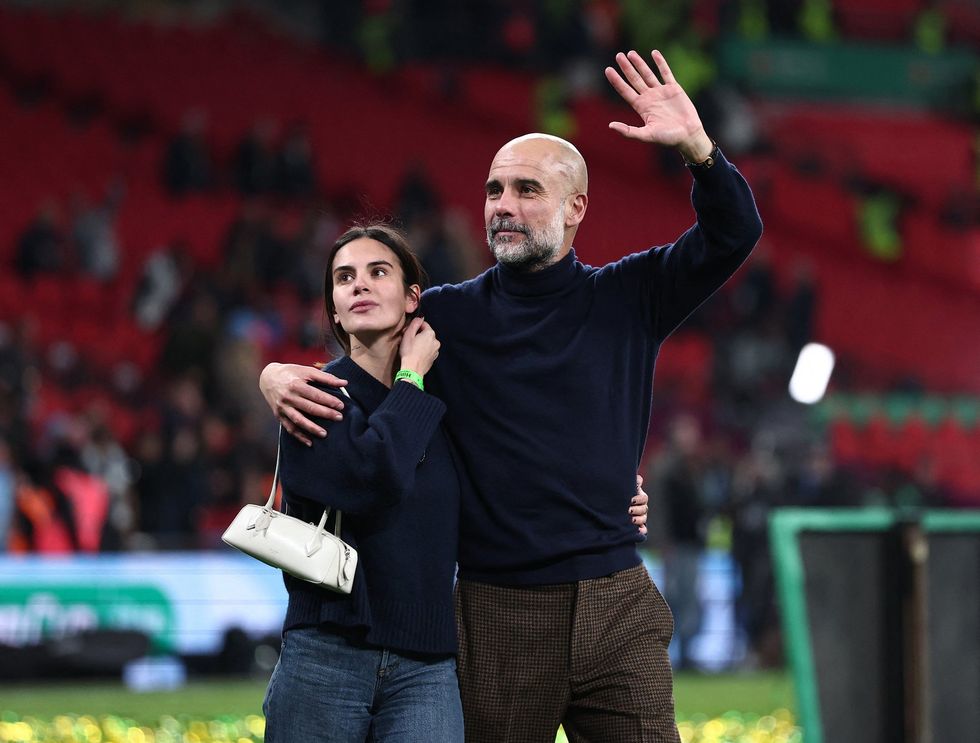 Pep Guardiola's daughter Maria made her way onto the pitch at Wembley to celebrate with her father
