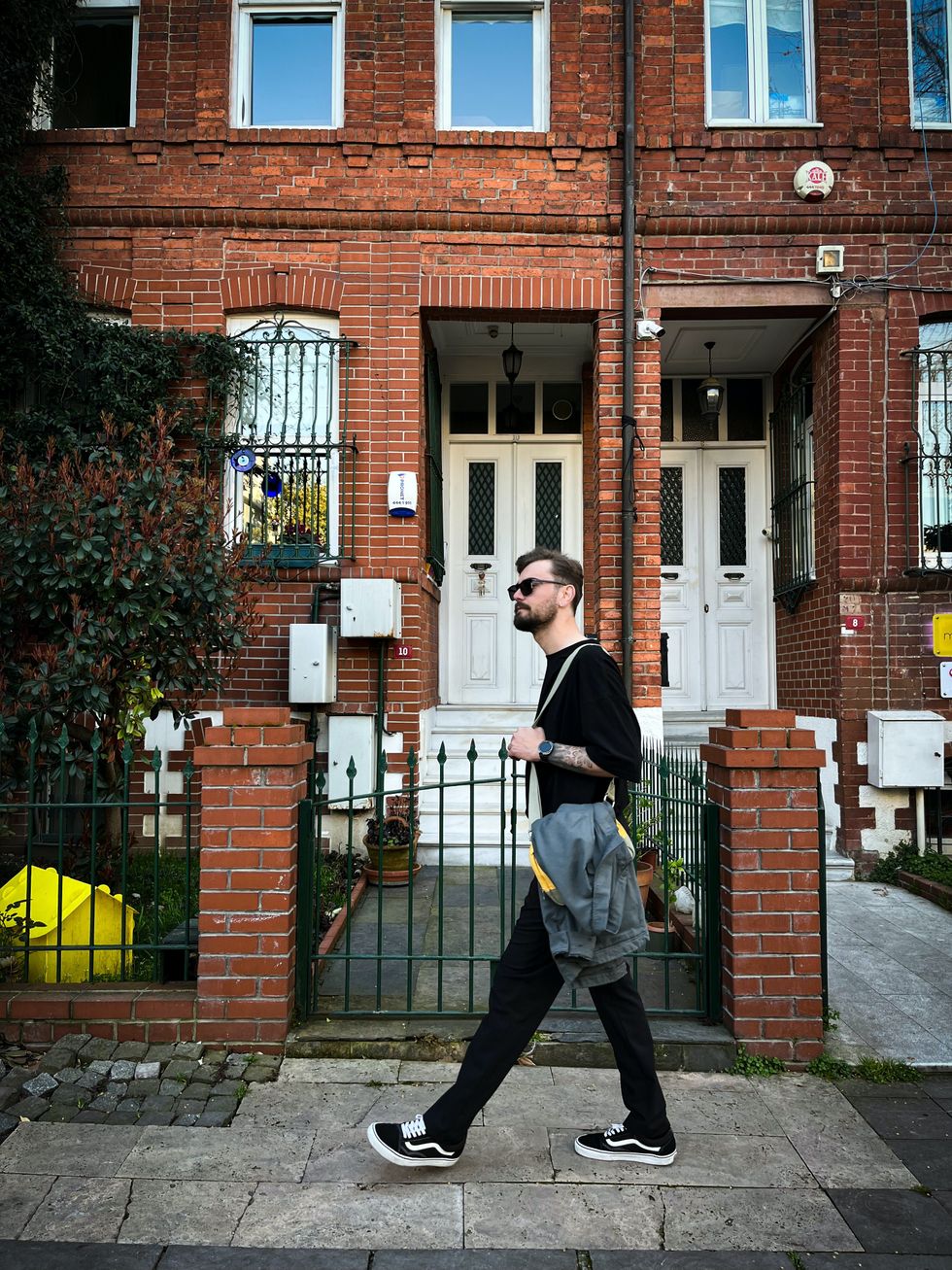 Person by terraced house
