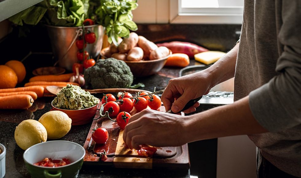 Person cutting vegetables