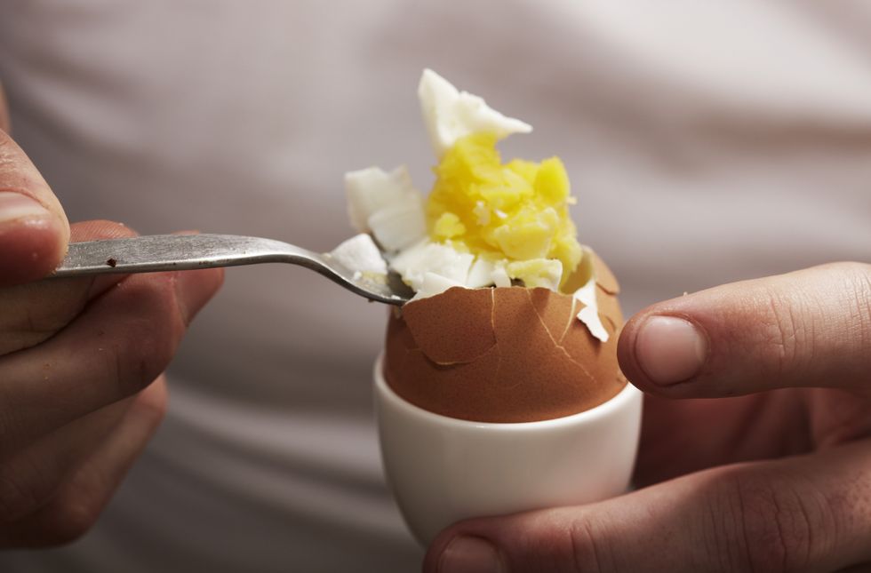 Person eating egg