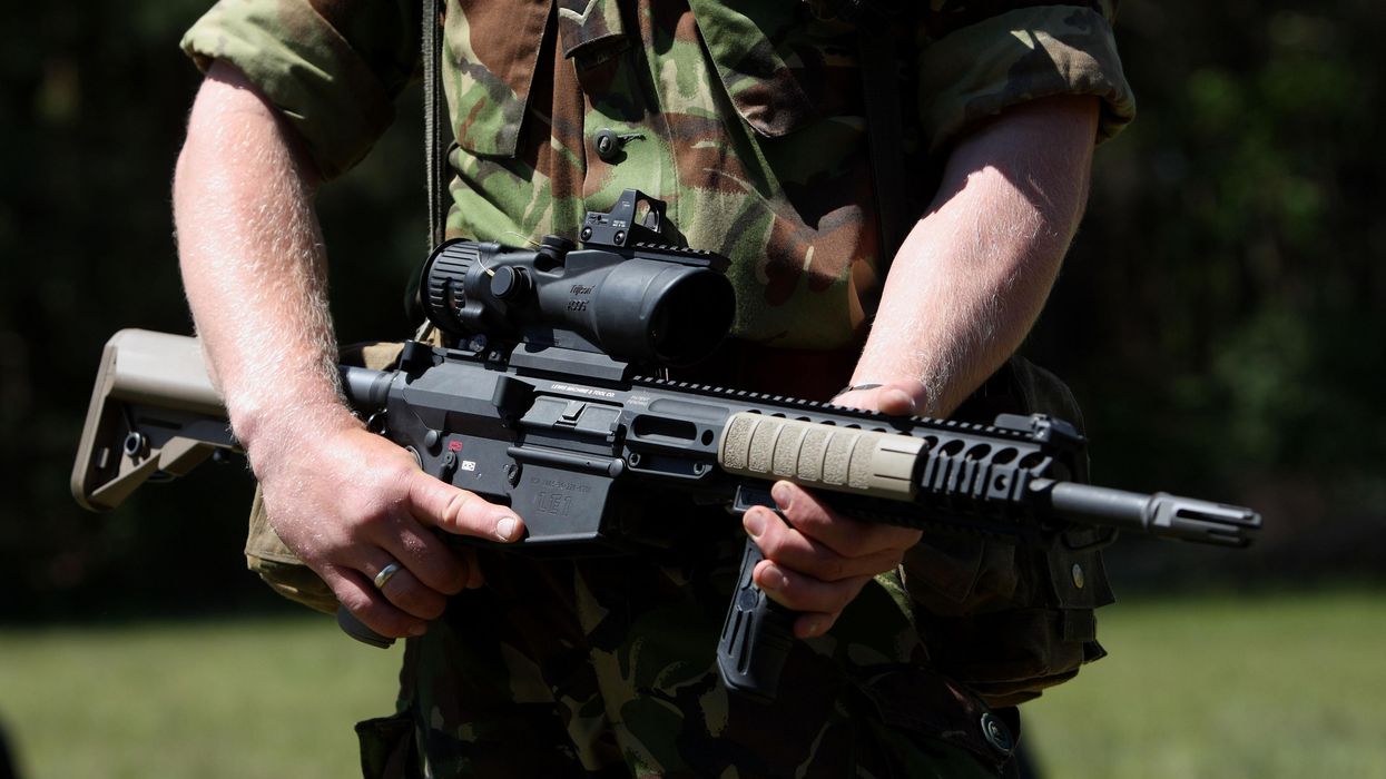 Person from Army holding a gun