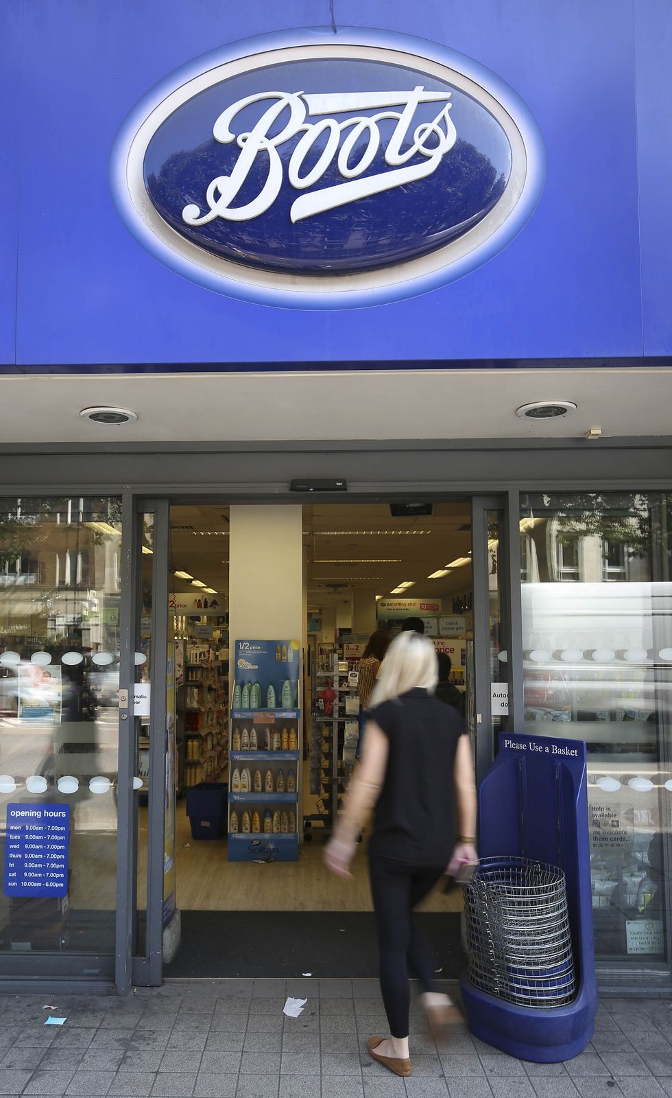 Person goes into Boots store