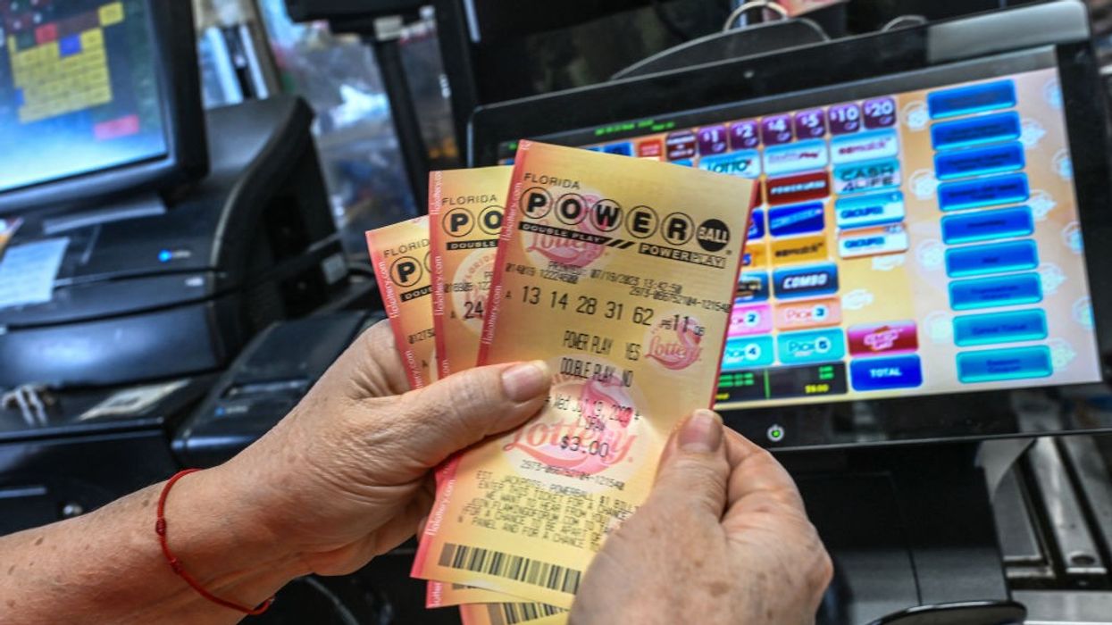 Person holding a Powerball ticket