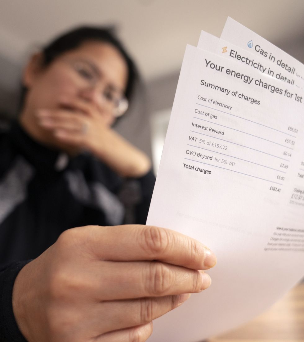 Person holding electricty bill statement