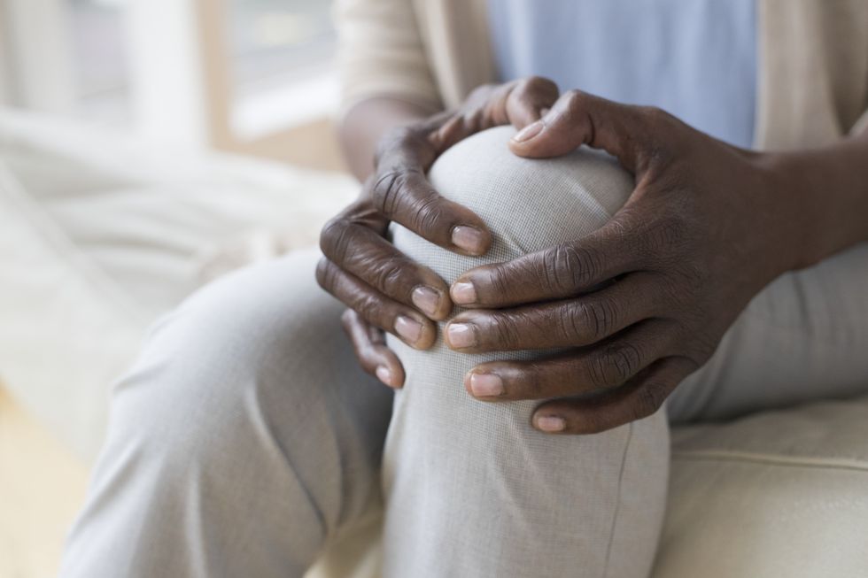 person holding knee