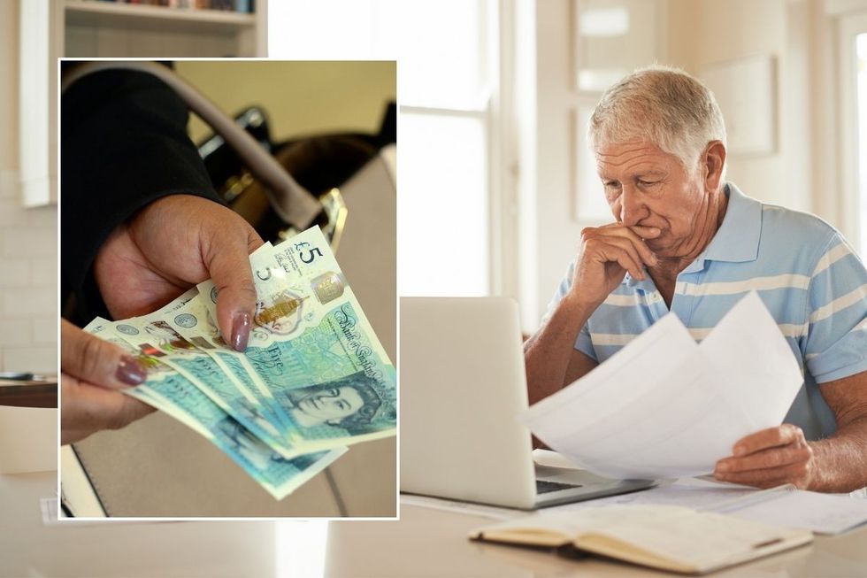 Person holding money and a man checking his laptop