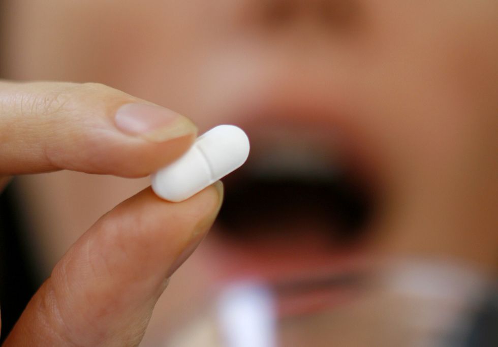 Person holding supplement
