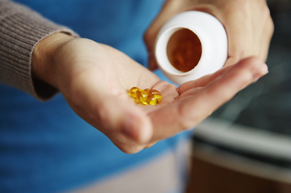 Person holding vitamin D