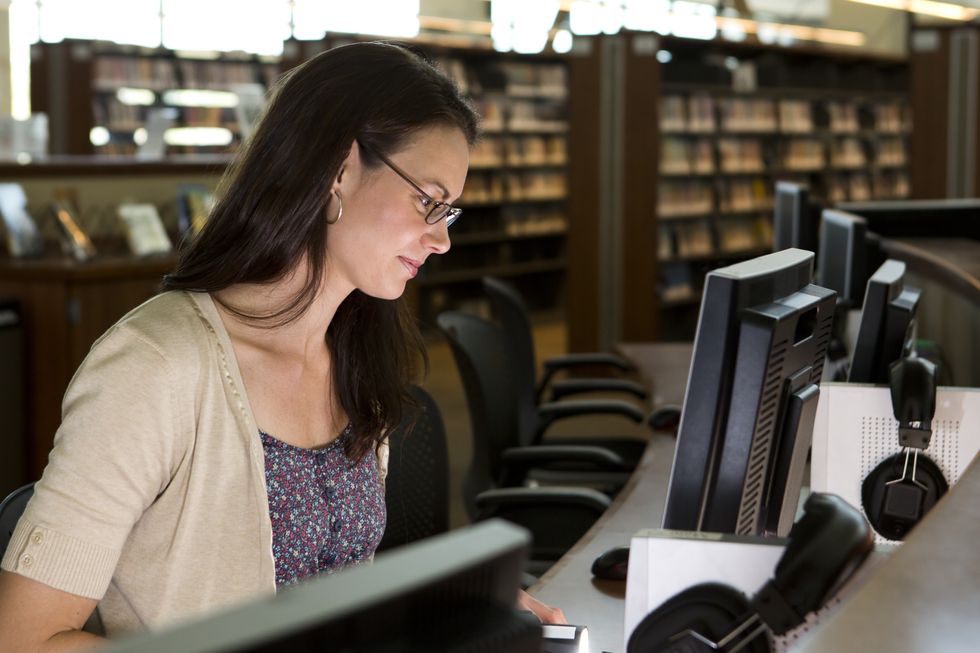 Person in library using computer