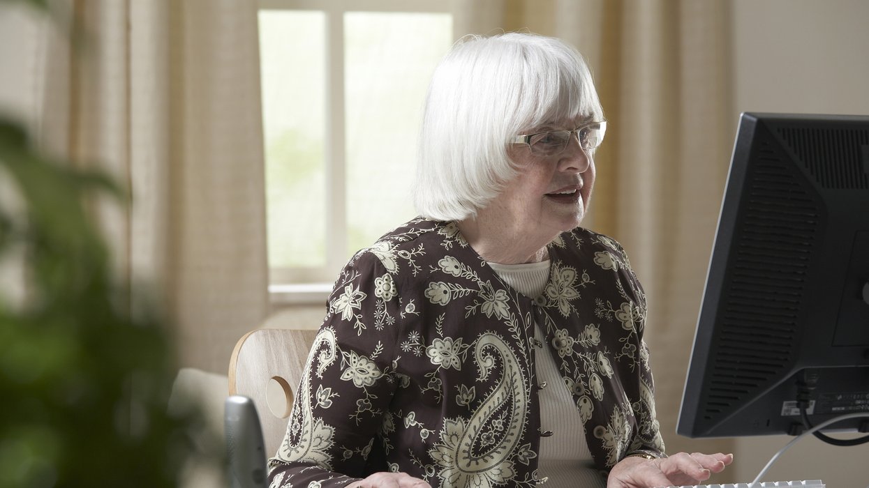 Person in retirement looks at computer