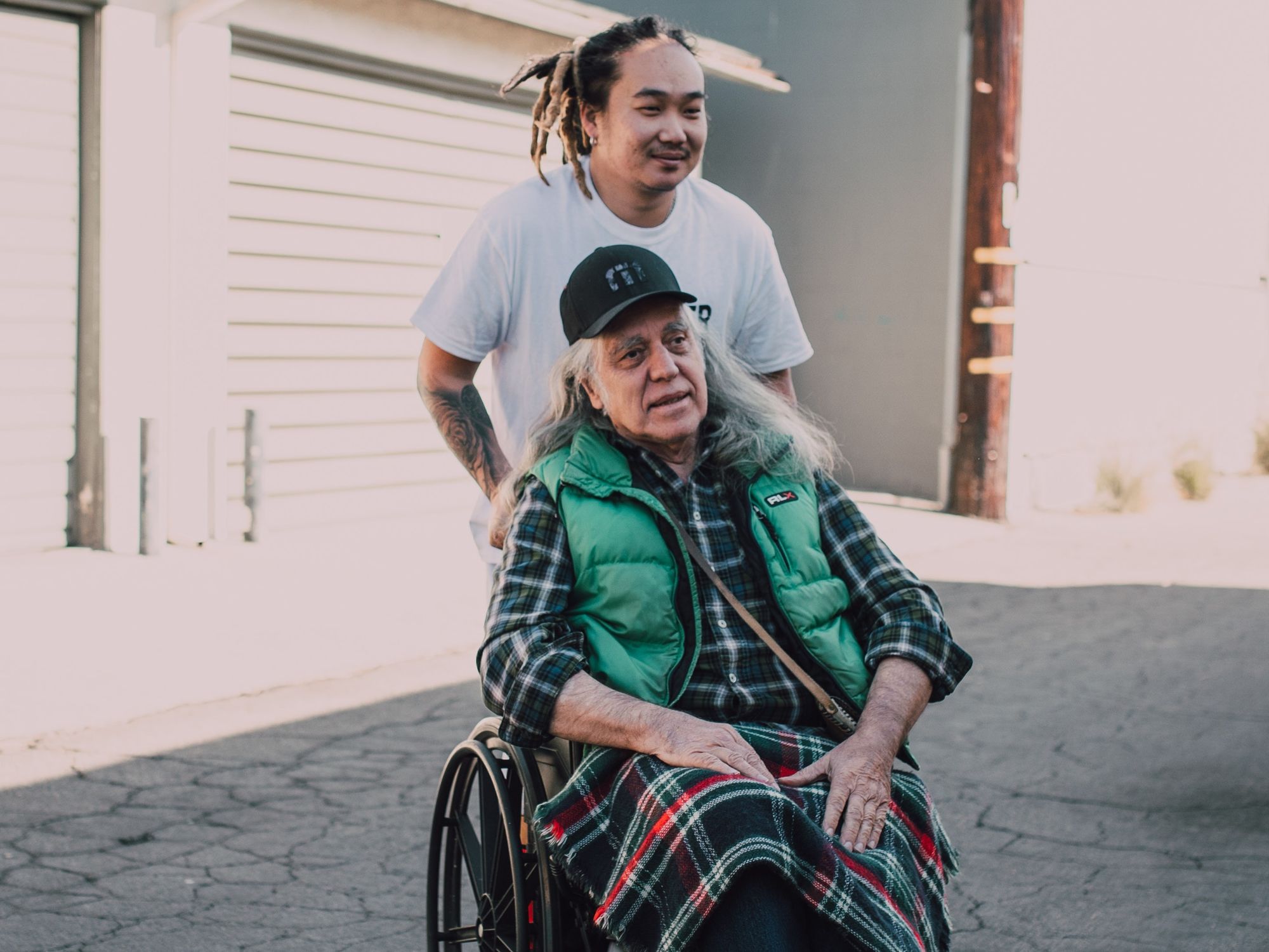 Person in wheelchair and another person in background