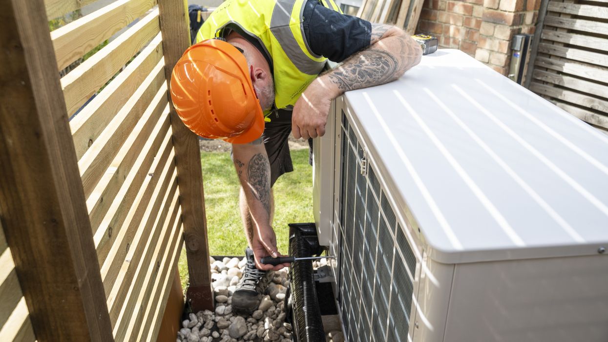 Person installing gas boiler