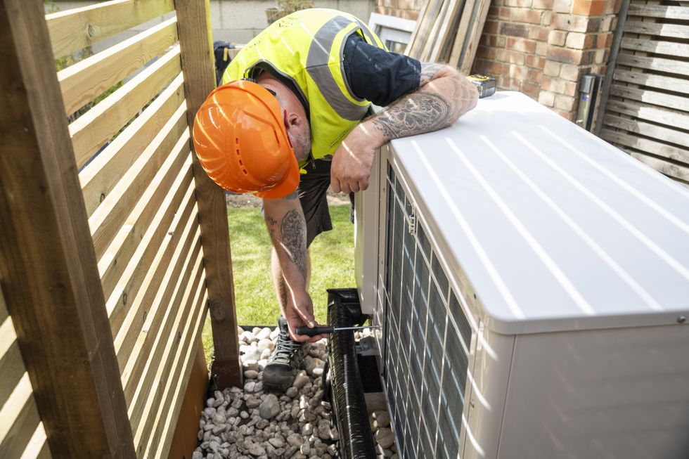 Person installing gas boiler